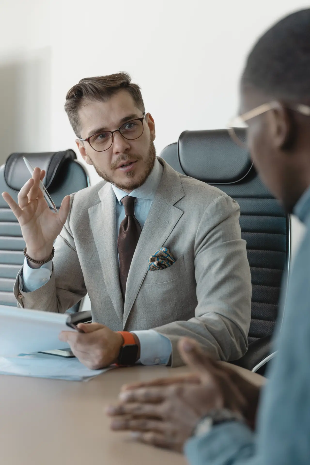 Executive in a suit conducting a recruitment interview